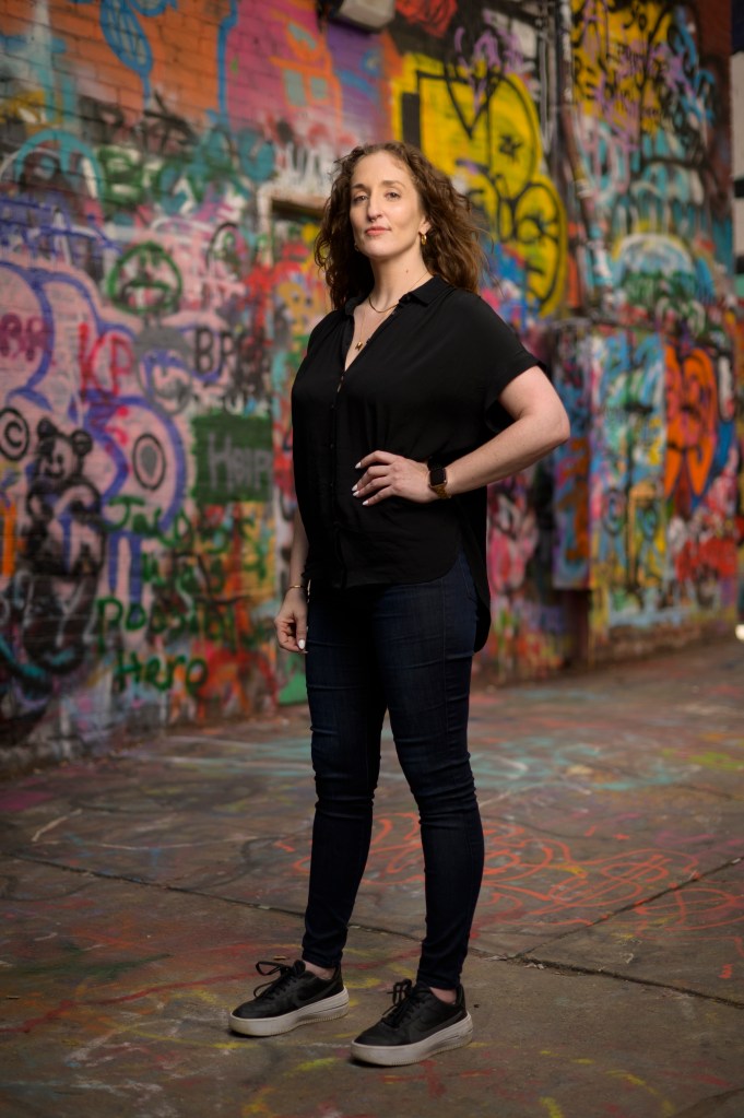 University of Michigan School of Information assistant professor Michaelanne Thomas pictured in the public graffiti alleyway in downtown Ann Arbor April 11, 2023.